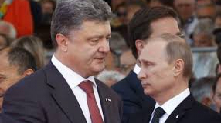 Vladimir Putin discută cu Petro Poroşenko despre detensionarea crizei ucrainene