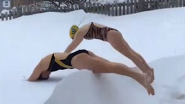 Americanii au inventat un nou "sport" de iarnă: înotul în zăpadă. Imaginile sunt virale