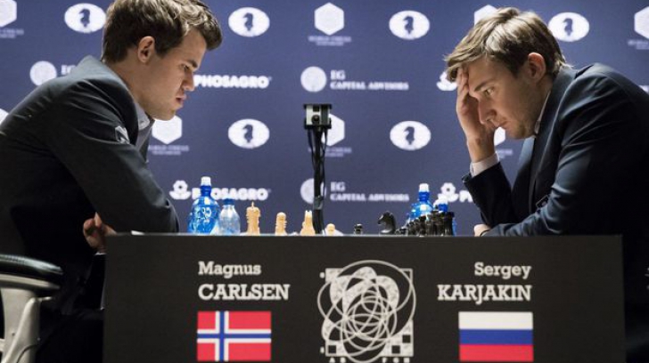 Şah. Remiză între Carlsen şi Karjakin în meciul 12. Miercuri se decide campionul mondial 