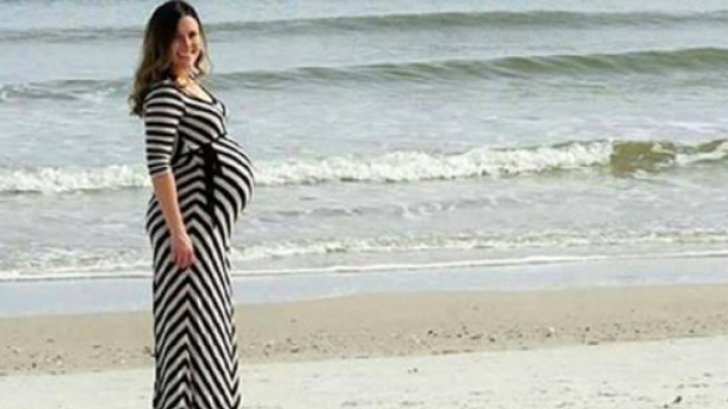 Şi-a fotografiat soţia însărcinată pe plajă. S-au uitat apoi acasă atent la poză şi ŞOC!
