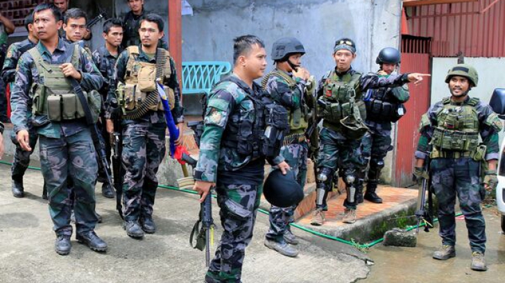 Aproximativ 200 de combatanți înarmați s-au baricadat într-o școală din Filipine