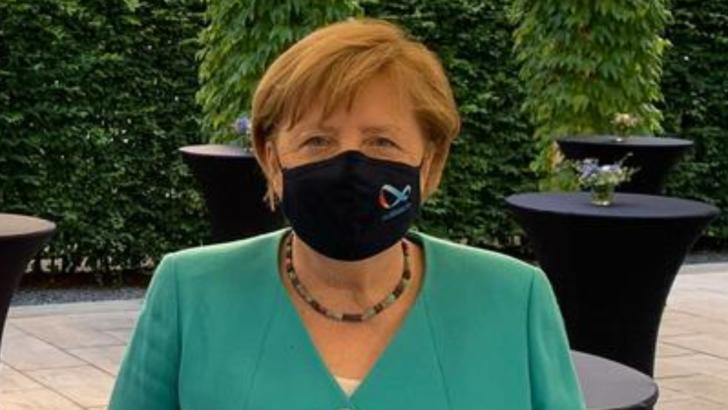 Angela Merkel, prima apariție în public cu mască de protecție