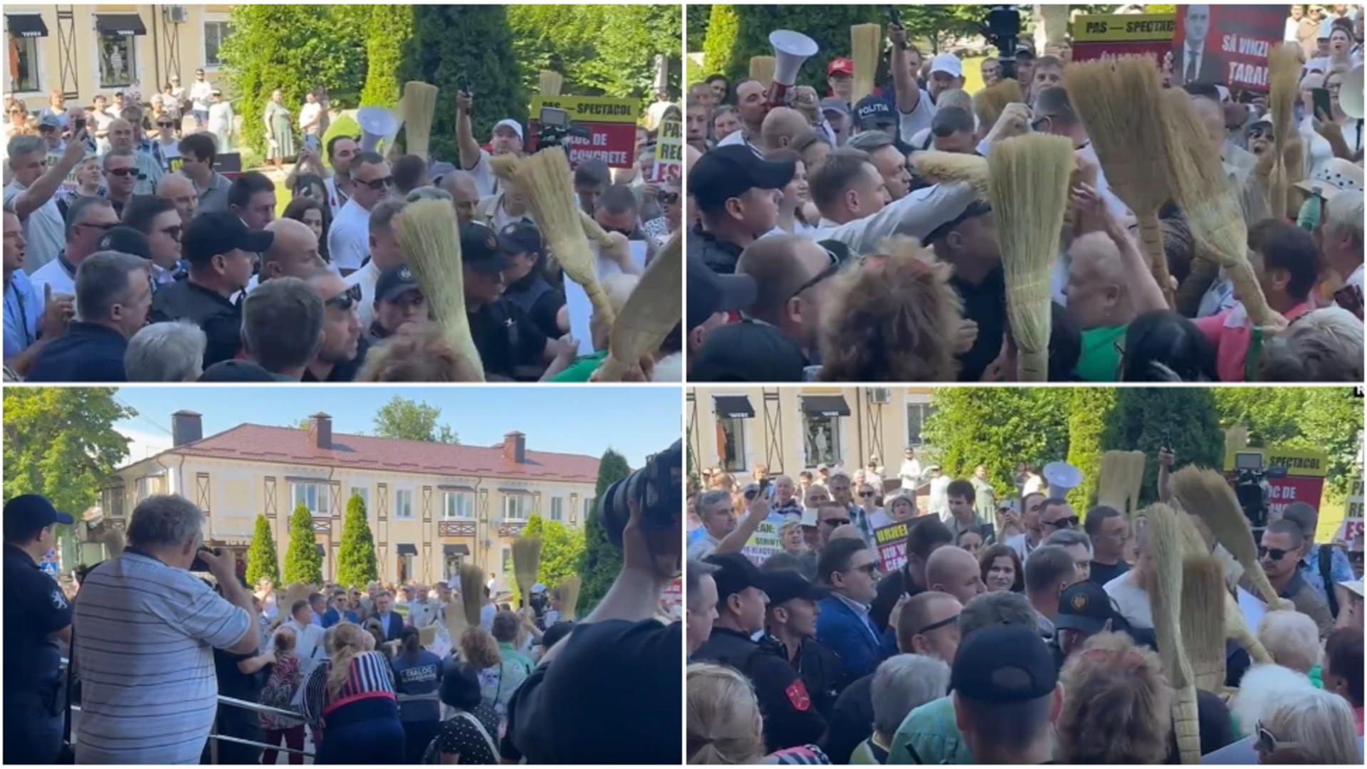 Premier lovit în cap cu mătura de protestatari. FOTO: Capura Realitatea PLUS
