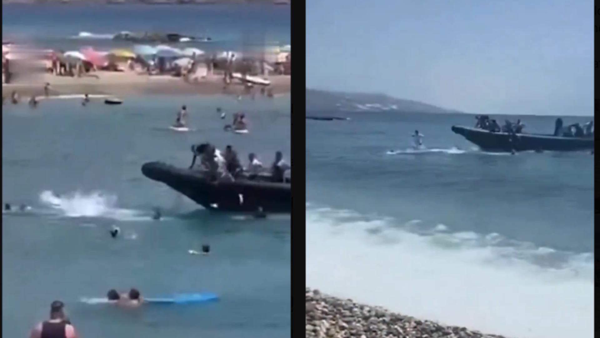 Momentul în care migranții veniți pe barcă iau cu asalt o plajă din Spania.